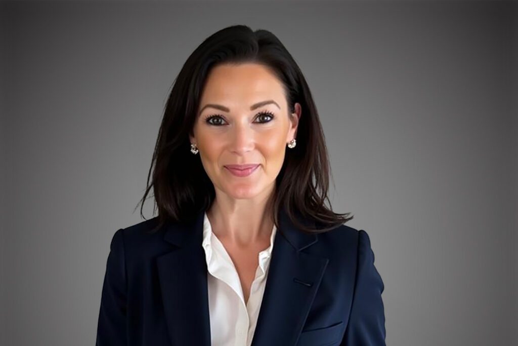 Headshot of Angela Sheppard in front of a gray background.