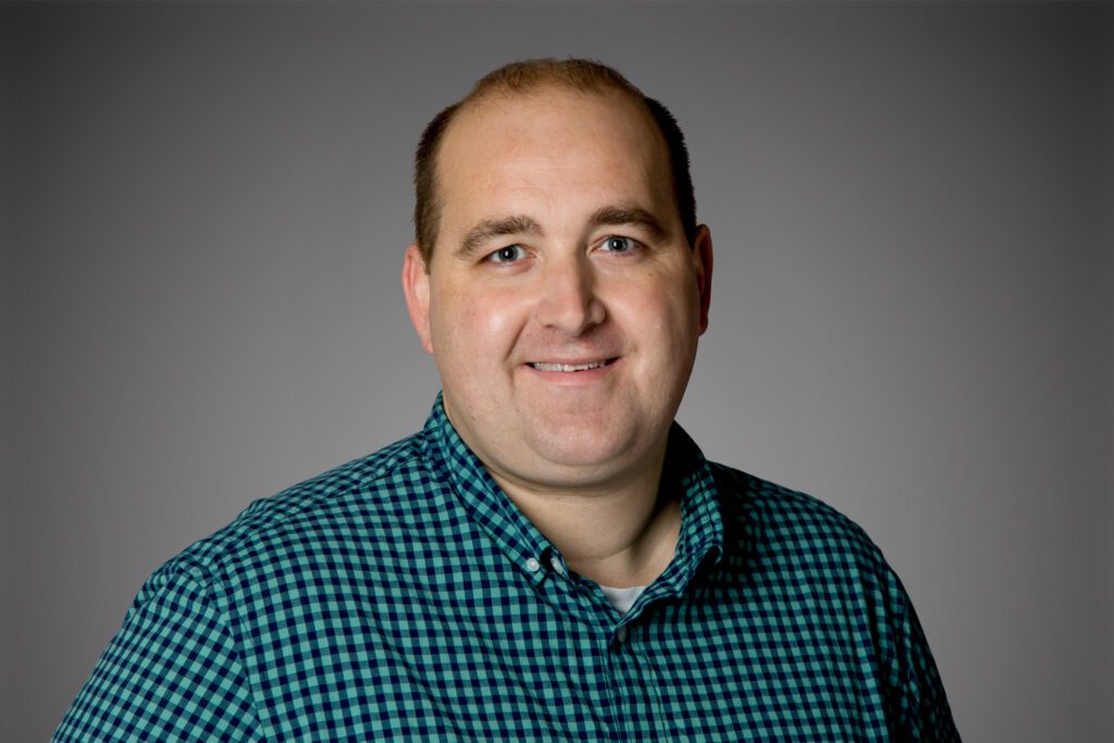Headshot of Jeff Kramer in front of a gray background.