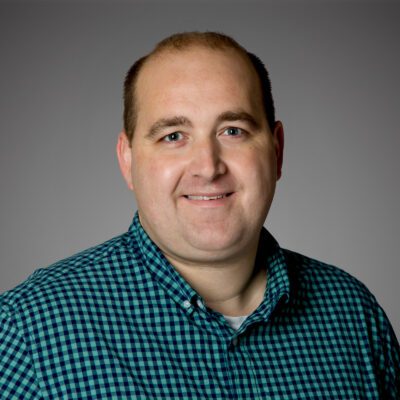 Headshot of Jeff Kramer in front of a gray background.