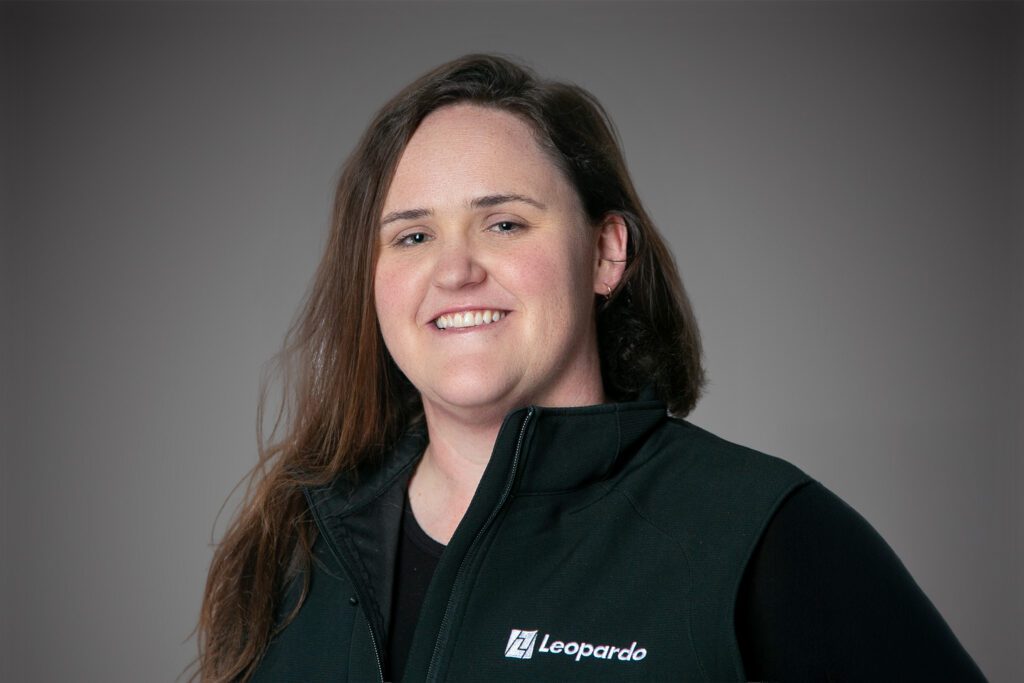 Headshot of Lauren Martin in front of a gray background.