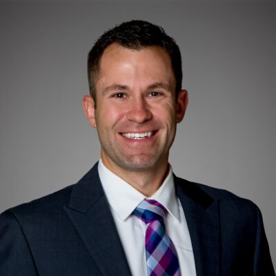 Headshot of Ryan Haase in front of a gray background.