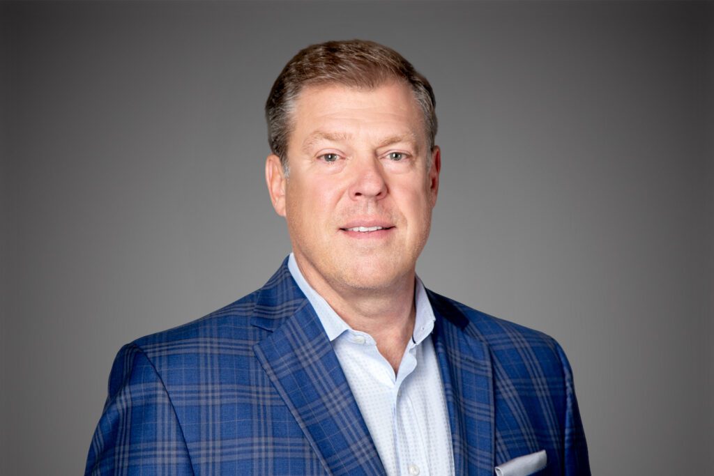 Headshot of Steve Smith in front of gray background.