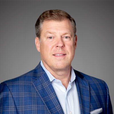 Headshot of Steve Smith in front of gray background.